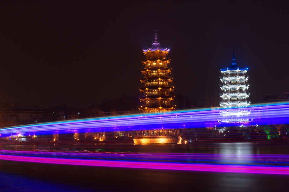Night photograph of the Sun and Moon Pagoda, Guilin, China